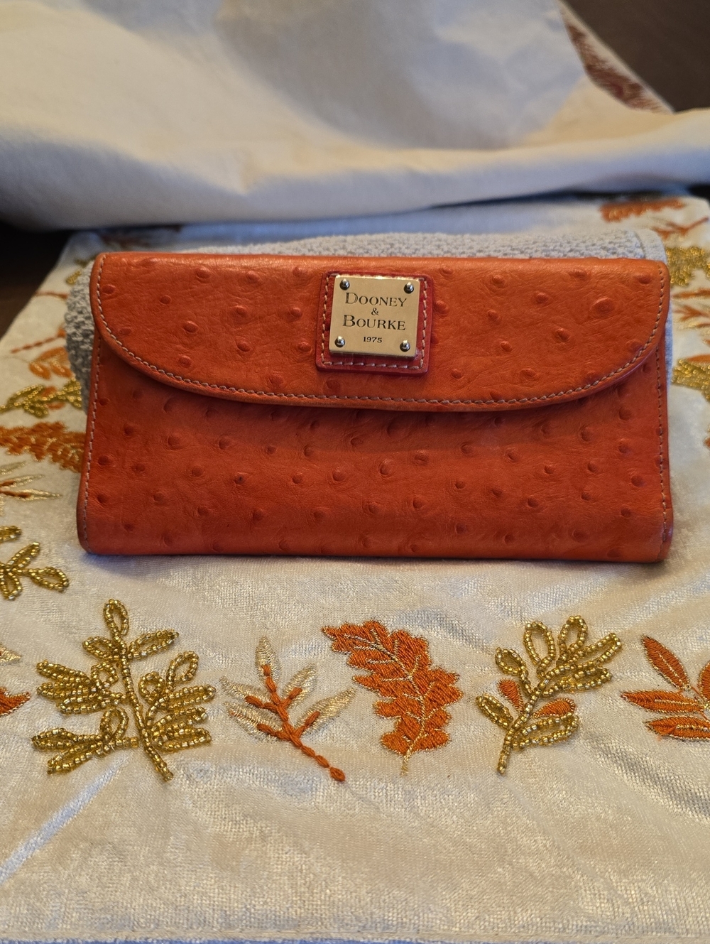 Dooney & Bourke Orange Ostrich-Embossed Flap Wallet